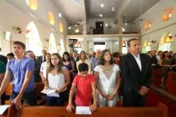 Eduardo Campos  e família em missa na paróquia de Casa Forte em abril de 2014